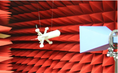 scaled rocket model in front of an antenna in a semi-anechoic chamber