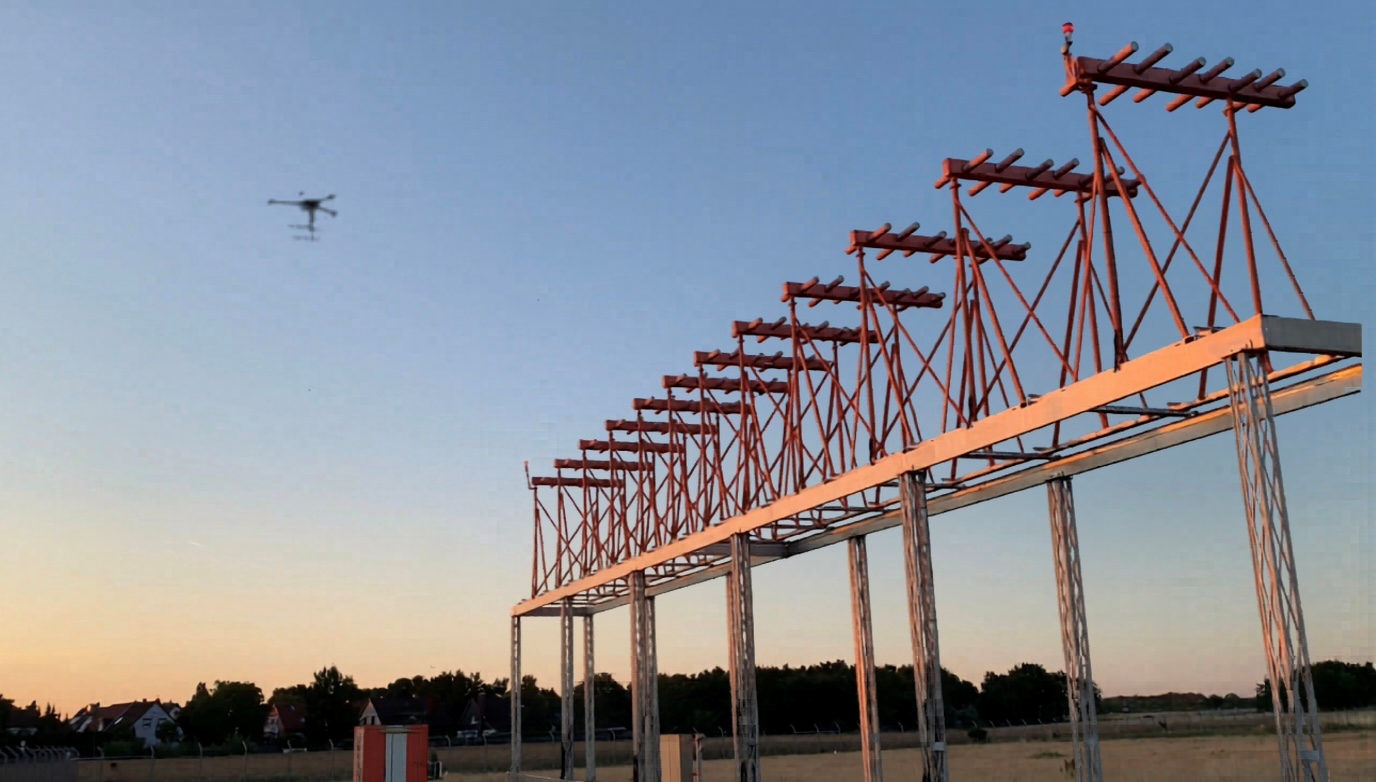 drone flying in the vicinity of an instrument landing system at an airport